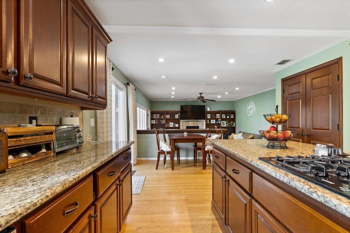 2565 Bertella Road Cameron Park, CA 95682 - Photo 19 of 31 a kitchen with stainless steel appliances granite countertop counter space a sink and a stove