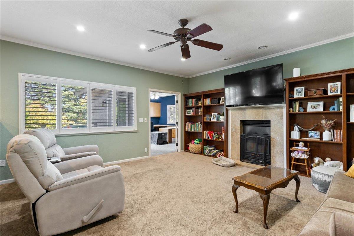 2565 Bertella Road Cameron Park, CA 95682 - Photo 21 of 31 a living room with furniture and a fireplace