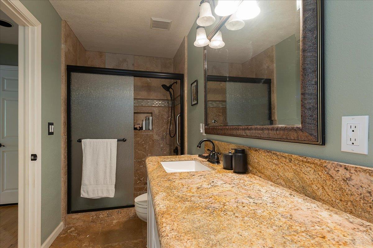 2565 Bertella Road Cameron Park, CA 95682 - Photo 23 of 31 a bathroom with a sink and a mirror