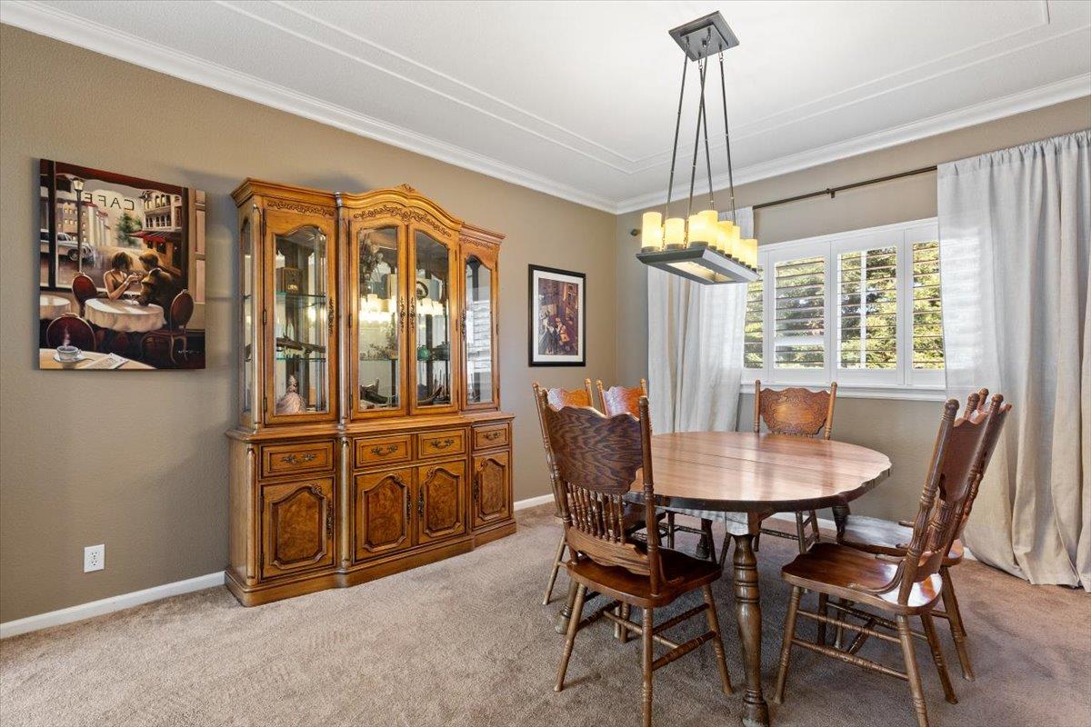 2565 Bertella Road Cameron Park, CA 95682 - Photo 8 of 31 a dining room with furniture a chandelier and window