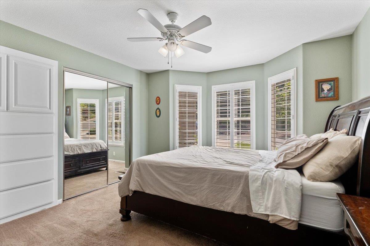 2565 Bertella Road Cameron Park, CA 95682 - Photo 10 of 31 a bedroom with a bed and a large window