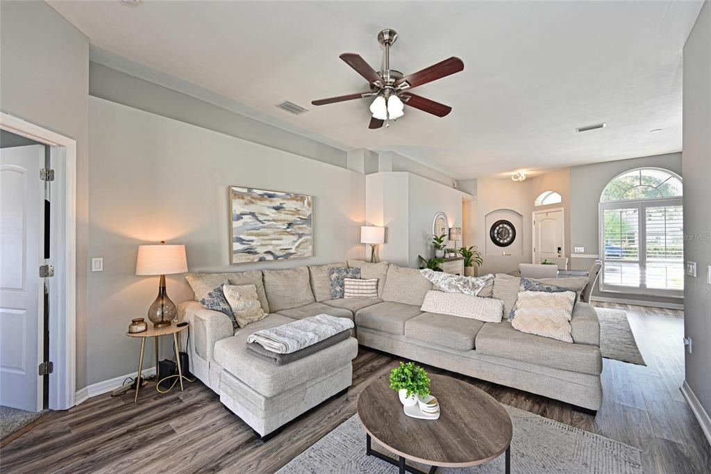 12709 Nightshade Place Lakewood Ranch, FL 34202 - Photo 16 of 53 a living room with furniture and a large window