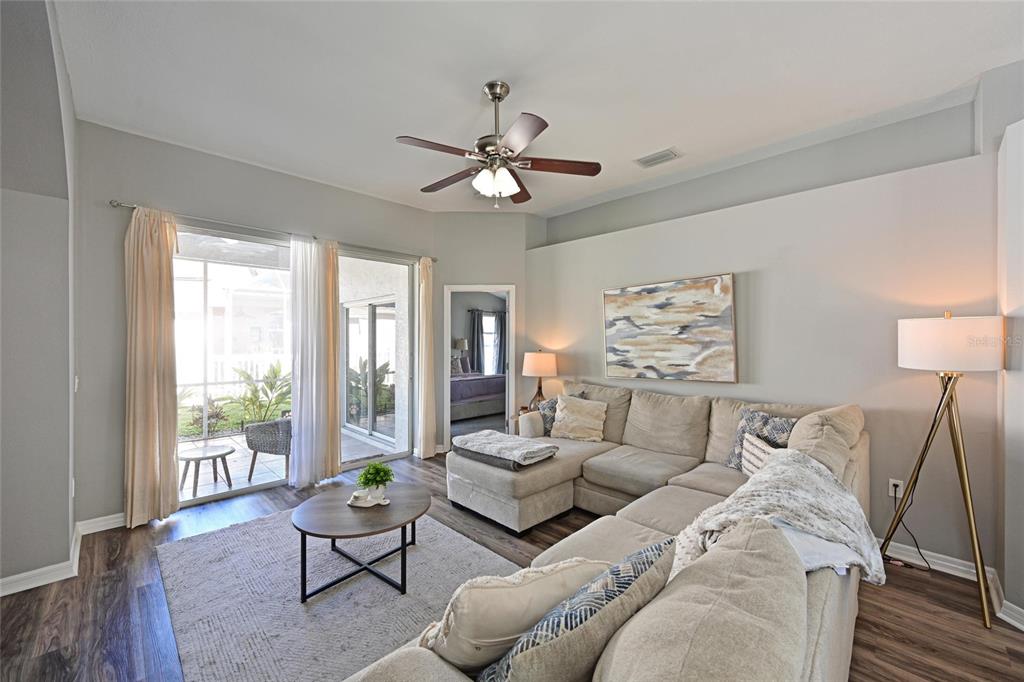 12709 Nightshade Place Lakewood Ranch, FL 34202 - Photo 17 of 53 a living room with furniture and a large window