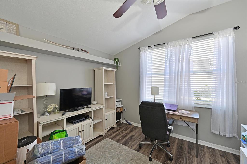 12709 Nightshade Place Lakewood Ranch, FL 34202 - Photo 18 of 53 a view of a livingroom with workspace and a window