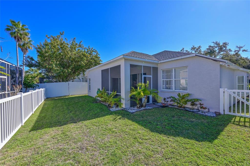 12709 Nightshade Place Lakewood Ranch, FL 34202 - Photo 23 of 53 a front view of a house with a yard and potted plants
