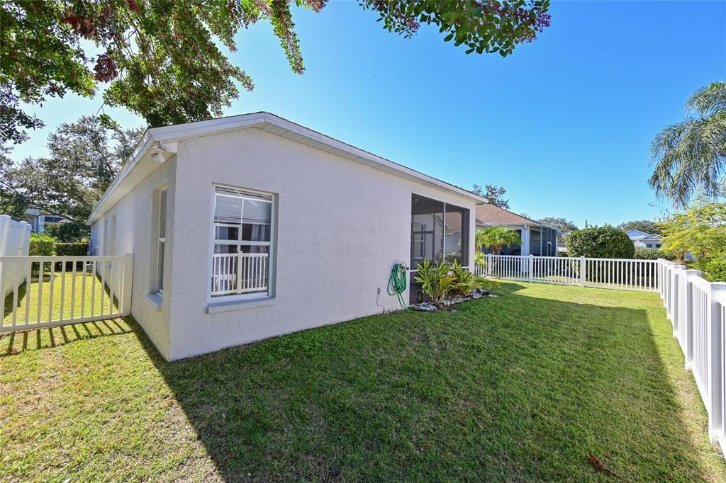 12709 Nightshade Place Lakewood Ranch, FL 34202 - Photo 24 of 53 a view of backyard of house and deck