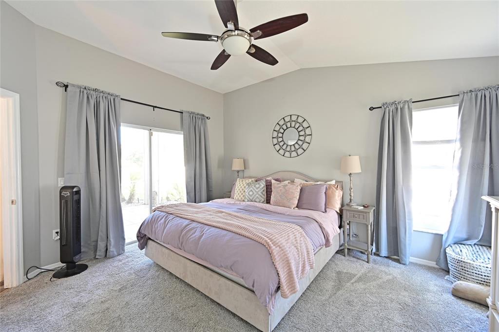 12709 Nightshade Place Lakewood Ranch, FL 34202 - Photo 26 of 53 a bedroom with a bed and a window