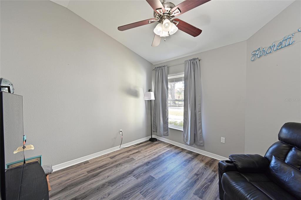 12709 Nightshade Place Lakewood Ranch, FL 34202 - Photo 29 of 53 a view of room with window and wooden floor
