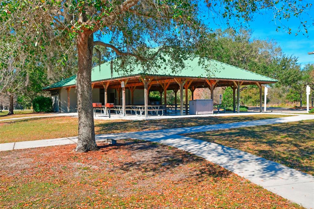 12709 Nightshade Place Lakewood Ranch, FL 34202 - Photo 40 of 53 a view of a house with backyard and porch