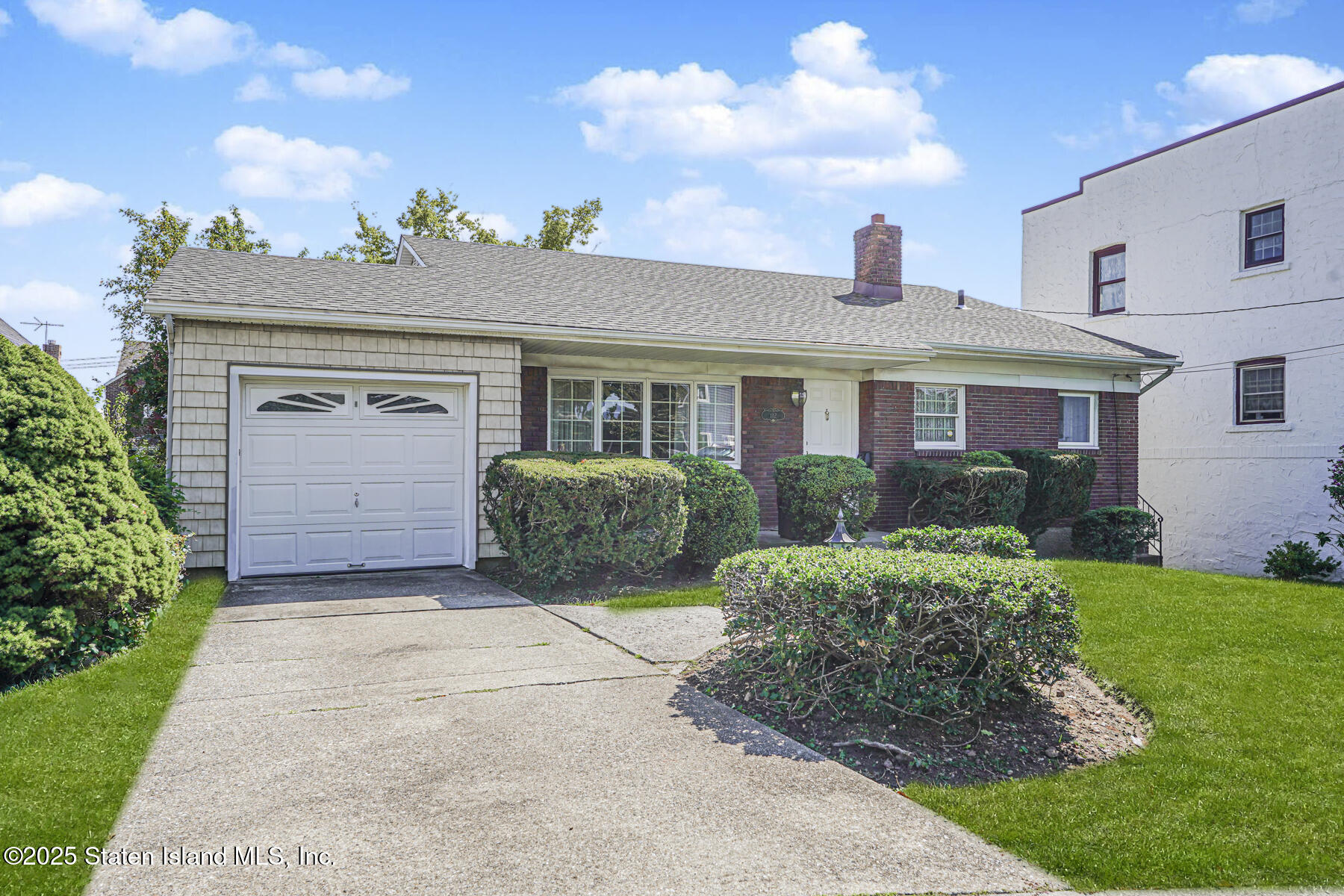 112 Windermere Road Staten Island, NY 10305 - Photo 1 of 32 a house view with a garden space