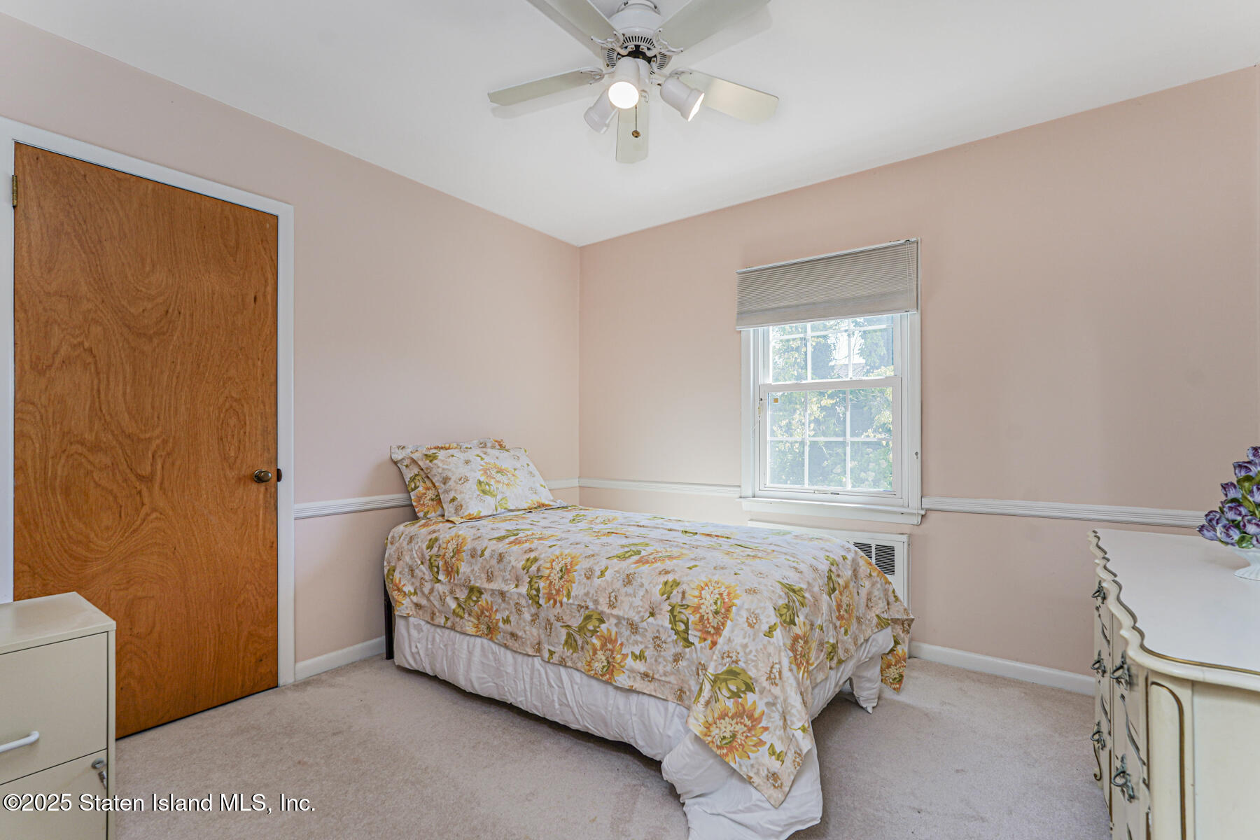 112 Windermere Road Staten Island, NY 10305 - Photo 13 of 32 a bedroom with a bed and window