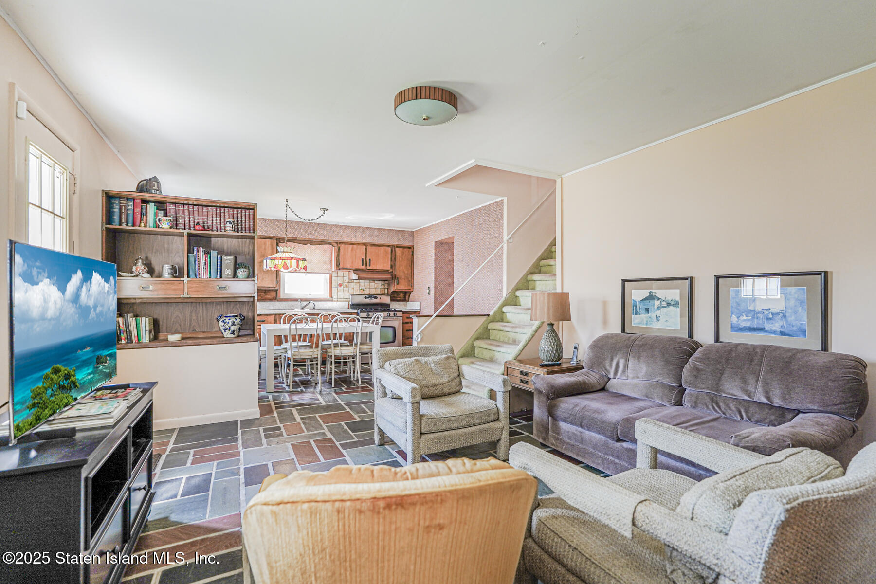 112 Windermere Road Staten Island, NY 10305 - Photo 22 of 32 a living room with furniture and a wooden floor