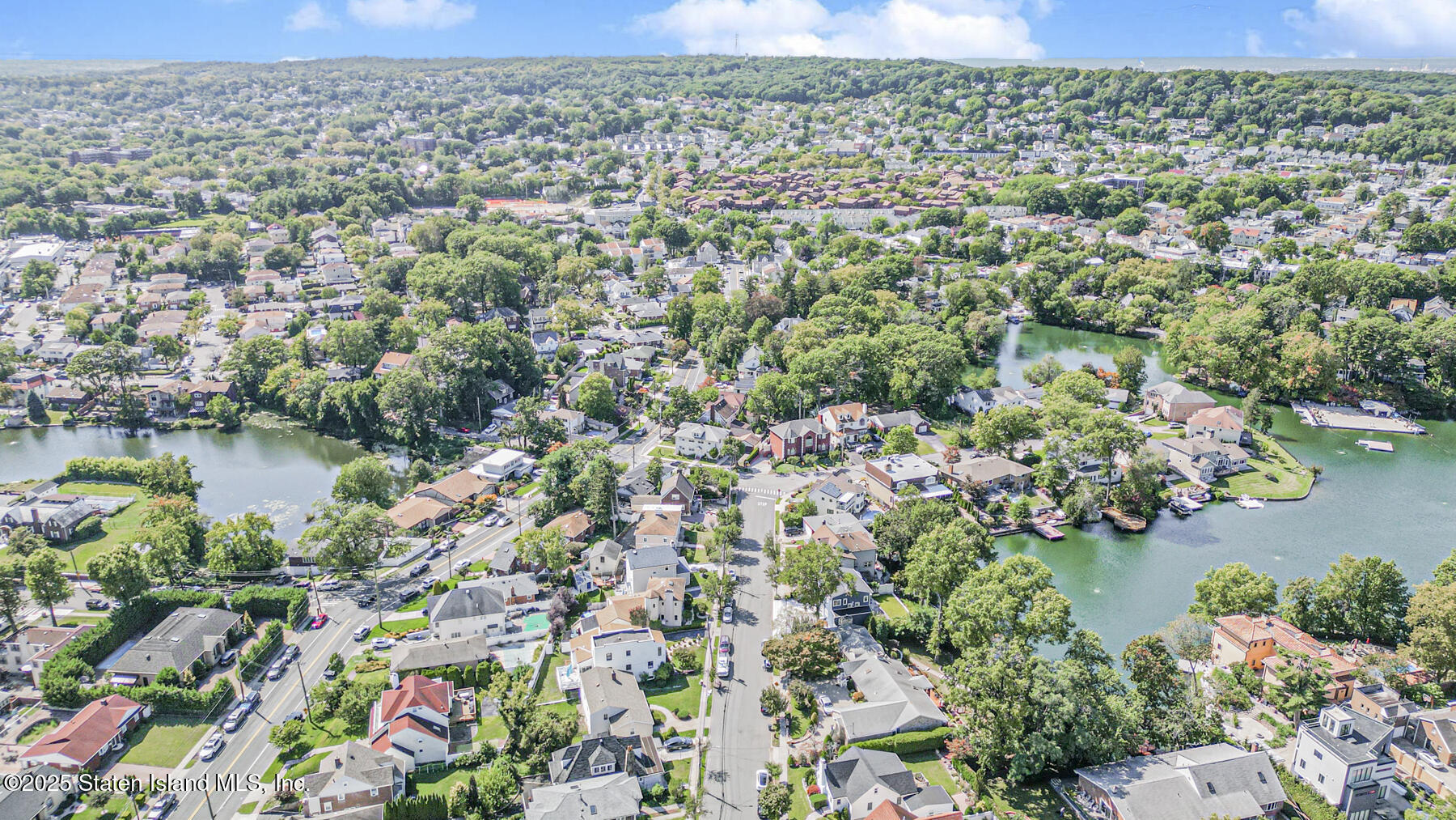 112 Windermere Road Staten Island, NY 10305 - Photo 26 of 32 an aerial view of a houses with a lake view