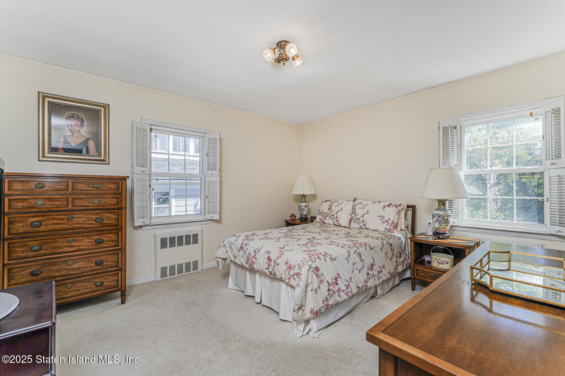 112 Windermere Road Staten Island, NY 10305 - Photo 10 of 32 a bedroom with a bed and a window