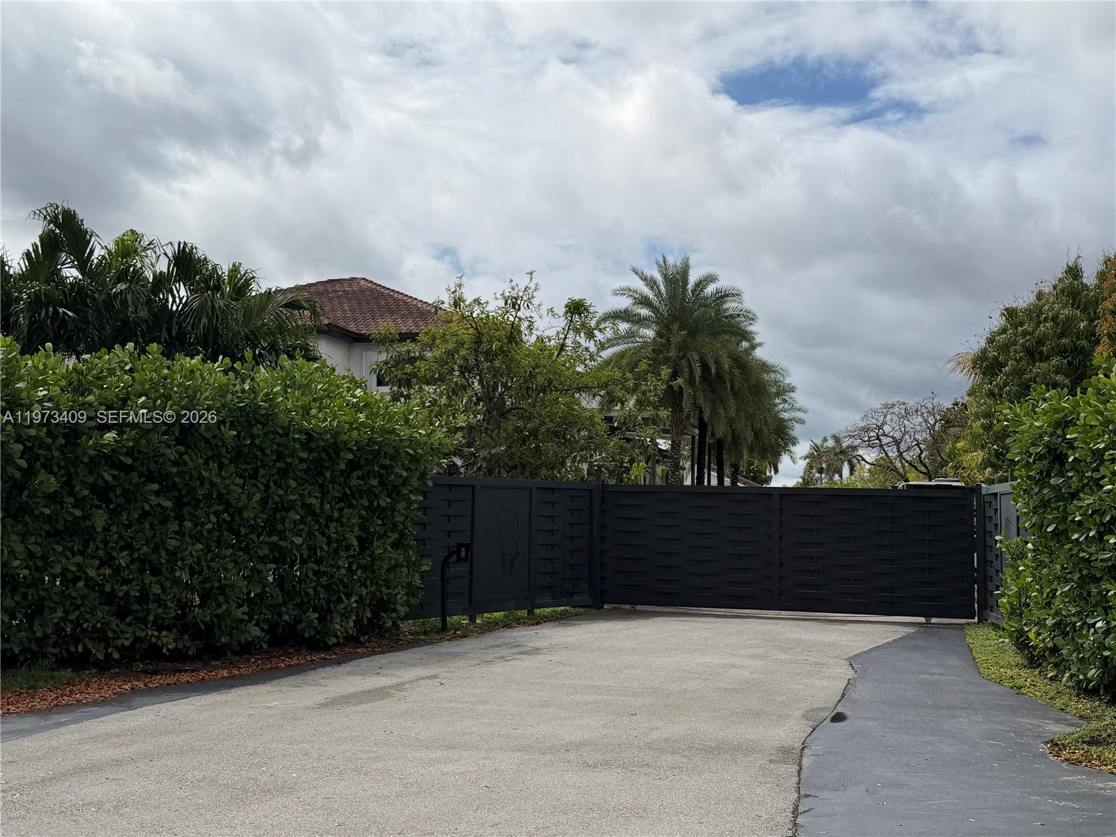 13050 Southwest 26th Street Miami, FL 33175 - Photo 1 of 1 a view of terrace with wooden fence
