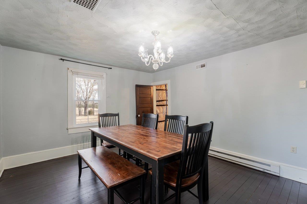 723 Sedwick Road Luray, VA 22835 - Photo 17 of 51 a view of a dining room with furniture window and wooden floor