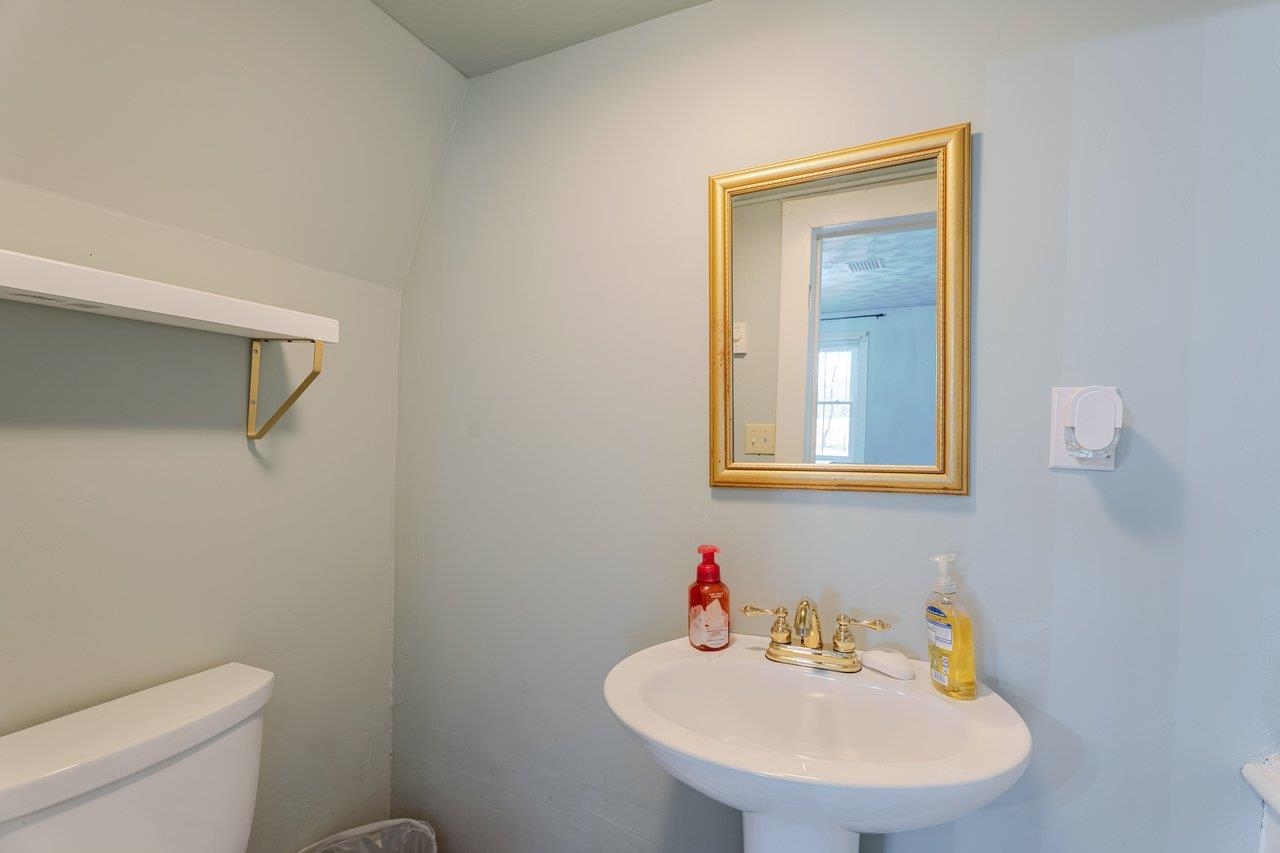 723 Sedwick Road Luray, VA 22835 - Photo 20 of 51 a bathroom with a toilet a sink and mirror