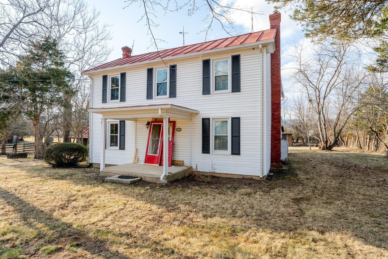 723 Sedwick Road Luray, VA 22835 - Photo 38 of 51 a view of a white house with large windows and a small yard