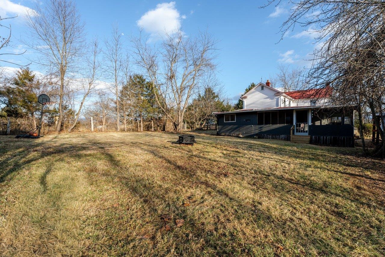 723 Sedwick Road Luray, VA 22835 - Photo 40 of 51 a view of a large white house with a yard covered with snow in the center