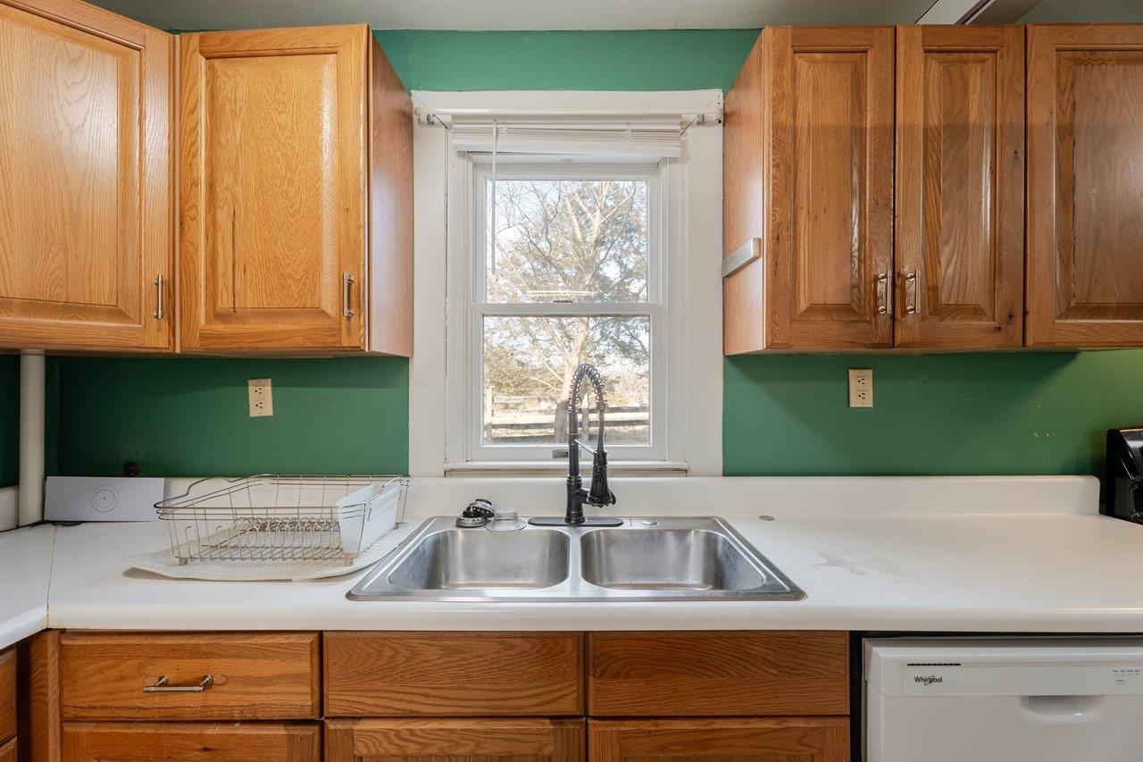 723 Sedwick Road Luray, VA 22835 - Photo 10 of 51 a kitchen with kitchen island a sink a counter cabinets and a window