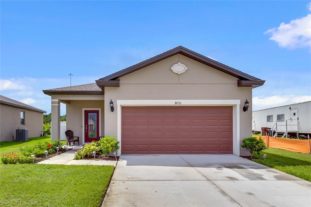 8650 Rindge Road Polk City, FL 33868 - Photo 1 of 1 a front view of house with yard and green space