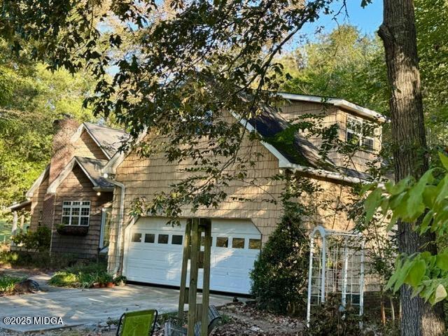 1193 Pea Ridge Road Juliette, GA 31046 - Photo 36 of 45 a front view of a house with a tree