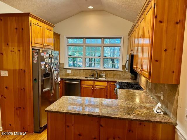 1193 Pea Ridge Road Juliette, GA 31046 - Photo 4 of 45 a kitchen with stainless steel appliances granite countertop a sink stove and refrigerator