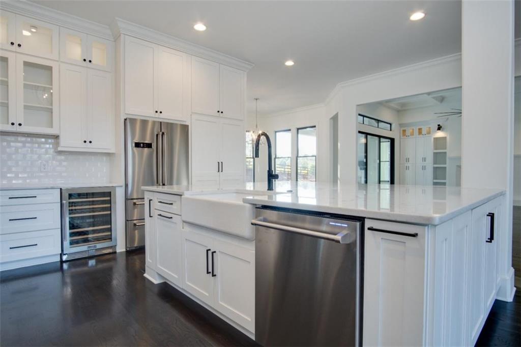 Lot 4 Cox Road Woodstock, GA 30188 - Photo 4 of 37 a kitchen with stainless steel appliances a sink and cabinets