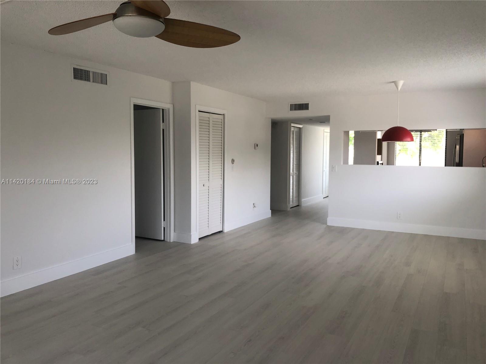 330 Racquet Club Road, Unit 201 Weston, FL 33326 - Photo 16 of 43 a view of a livingroom with wooden floor
