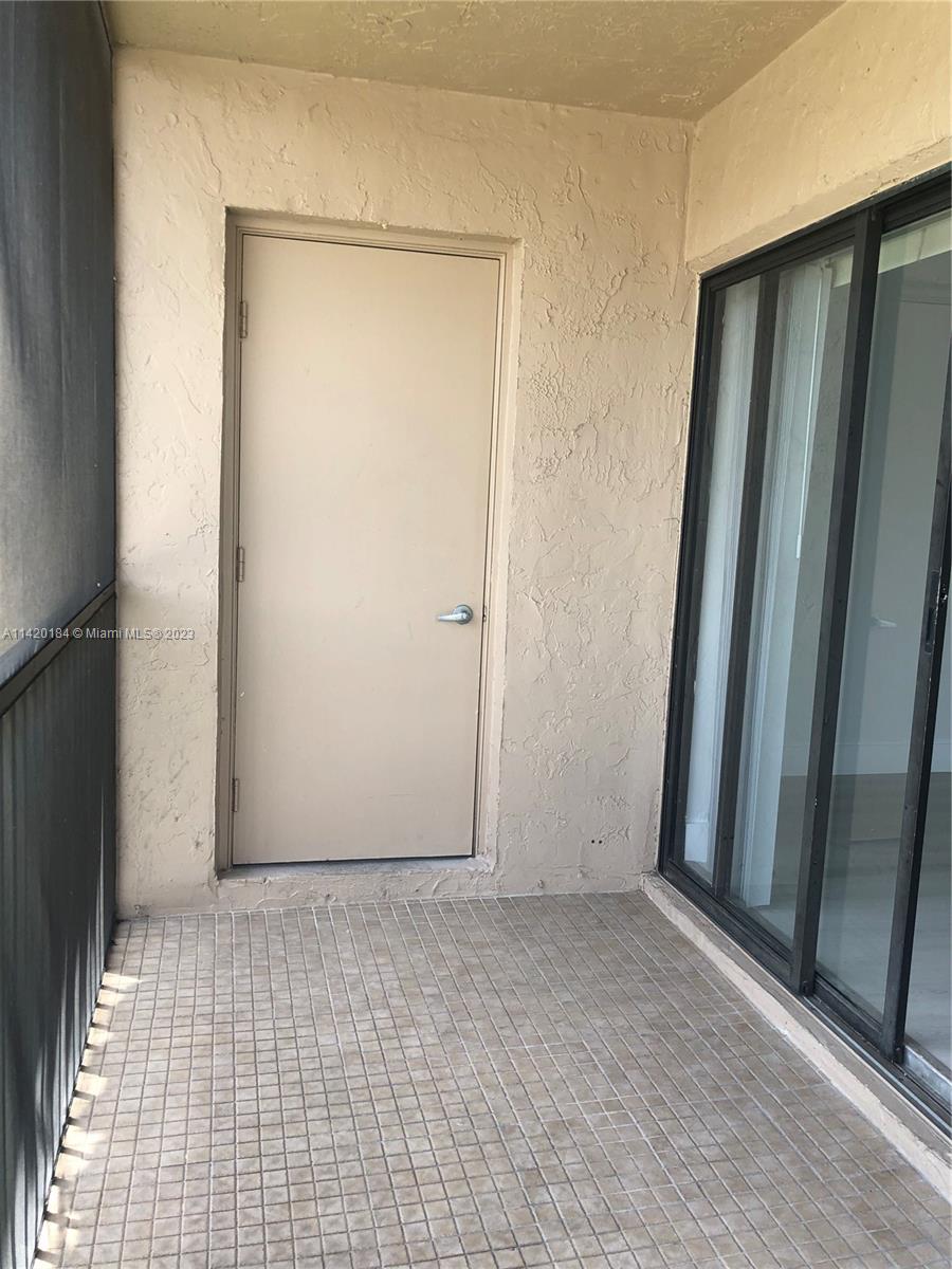 330 Racquet Club Road, Unit 201 Weston, FL 33326 - Photo 21 of 43 an empty room with window