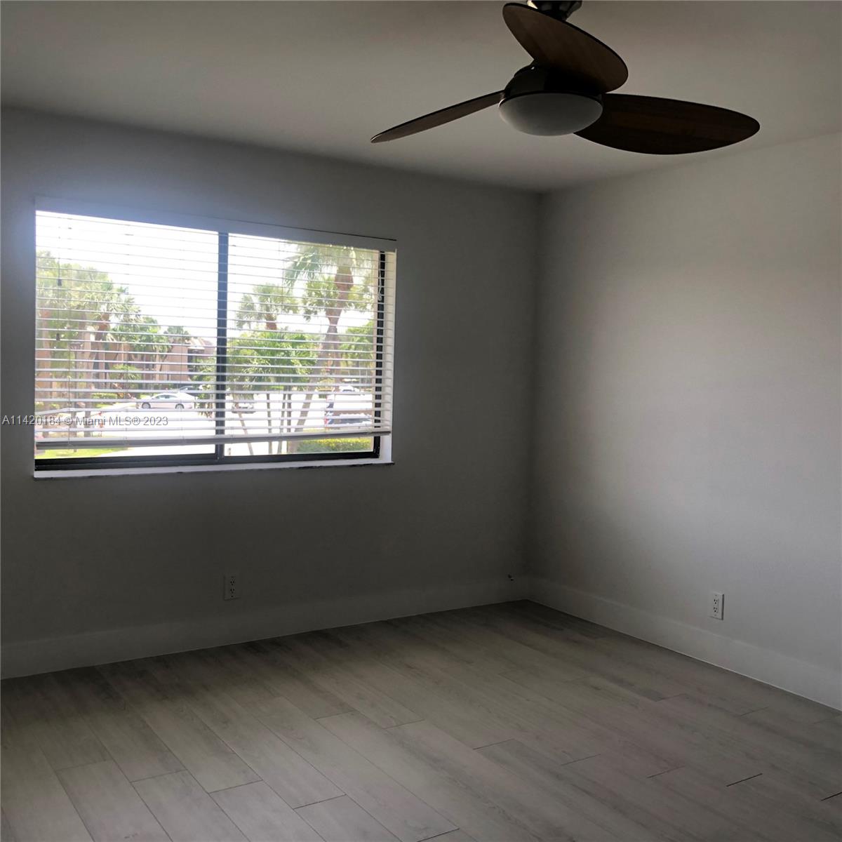 330 Racquet Club Road, Unit 201 Weston, FL 33326 - Photo 23 of 43 an empty room with a window