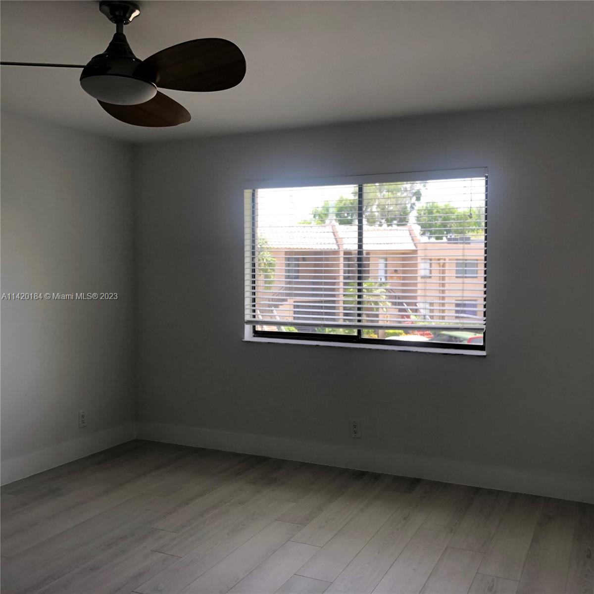 330 Racquet Club Road, Unit 201 Weston, FL 33326 - Photo 24 of 43 a view of an empty room with a window
