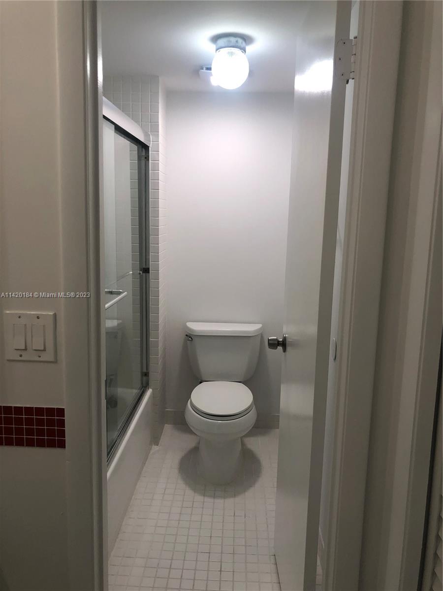 330 Racquet Club Road, Unit 201 Weston, FL 33326 - Photo 29 of 43 a bathroom with a toilet and a shower