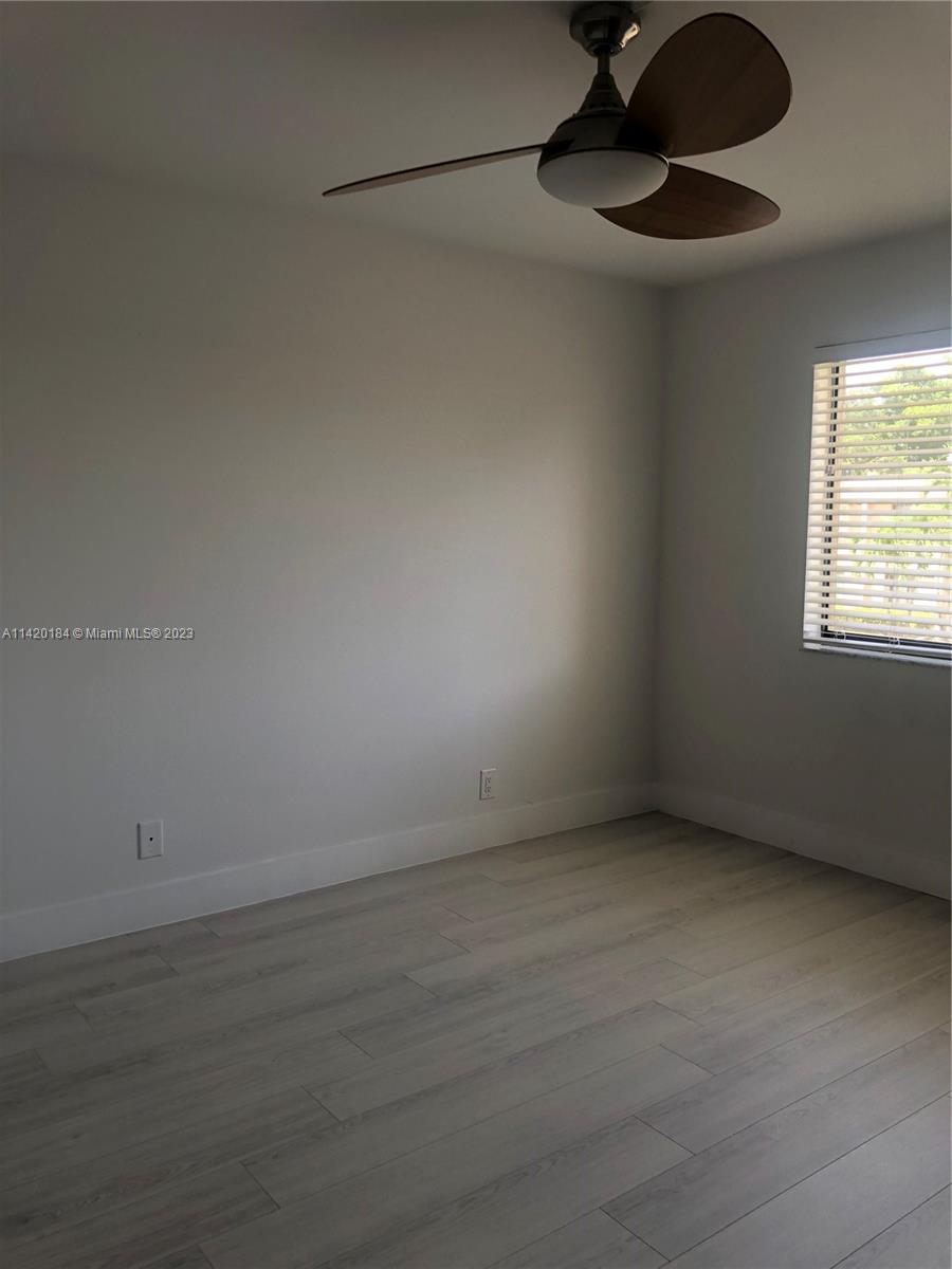 330 Racquet Club Road, Unit 201 Weston, FL 33326 - Photo 32 of 43 a view of an empty room with a window