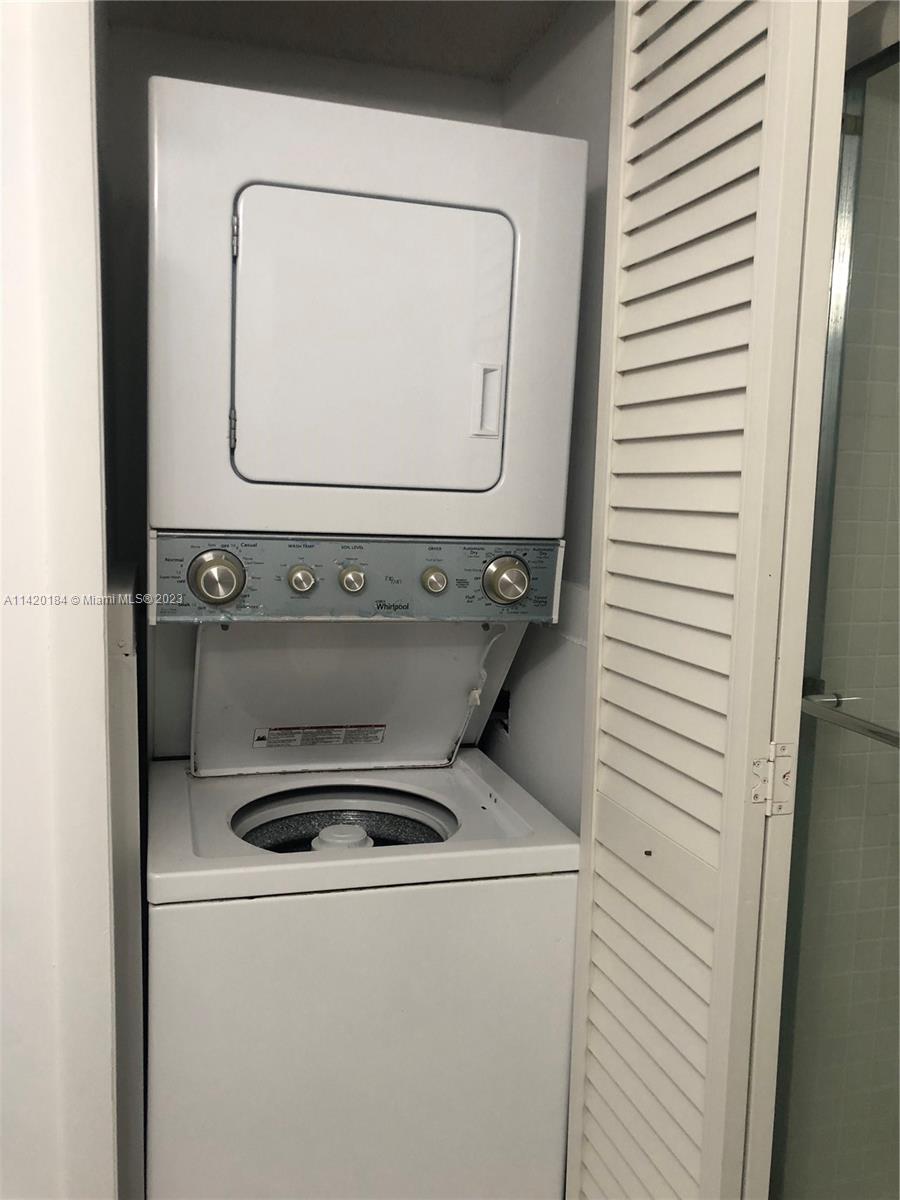 330 Racquet Club Road, Unit 201 Weston, FL 33326 - Photo 37 of 43 a utility room with washer and dryer