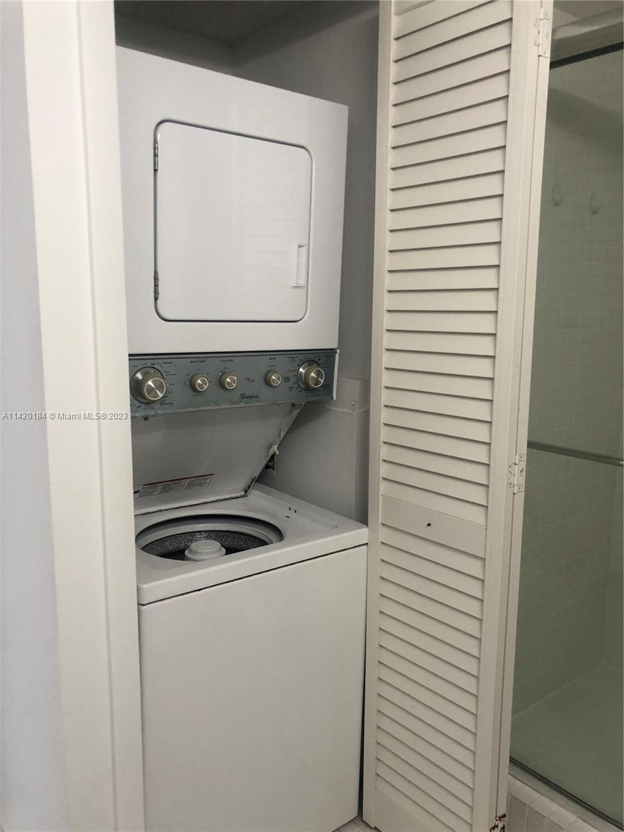330 Racquet Club Road, Unit 201 Weston, FL 33326 - Photo 38 of 43 a utility room with dryer and washer