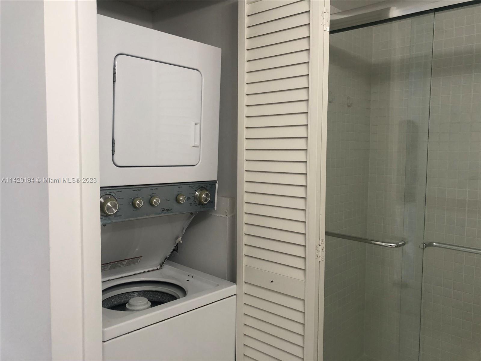 330 Racquet Club Road, Unit 201 Weston, FL 33326 - Photo 39 of 43 a utility room with a washer and dryer