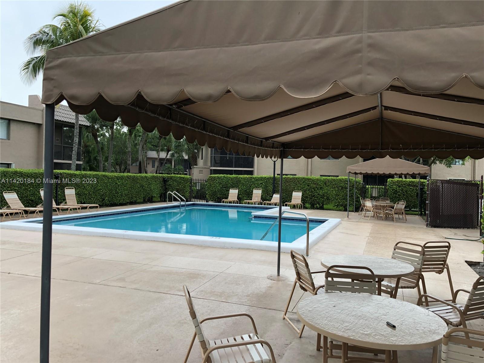 330 Racquet Club Road, Unit 201 Weston, FL 33326 - Photo 43 of 43 a view of a swimming pool with a patio