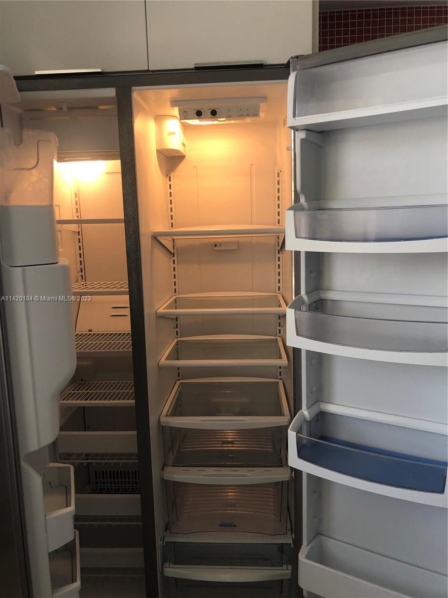 330 Racquet Club Road, Unit 201 Weston, FL 33326 - Photo 10 of 43 a view of an empty walk in closet
