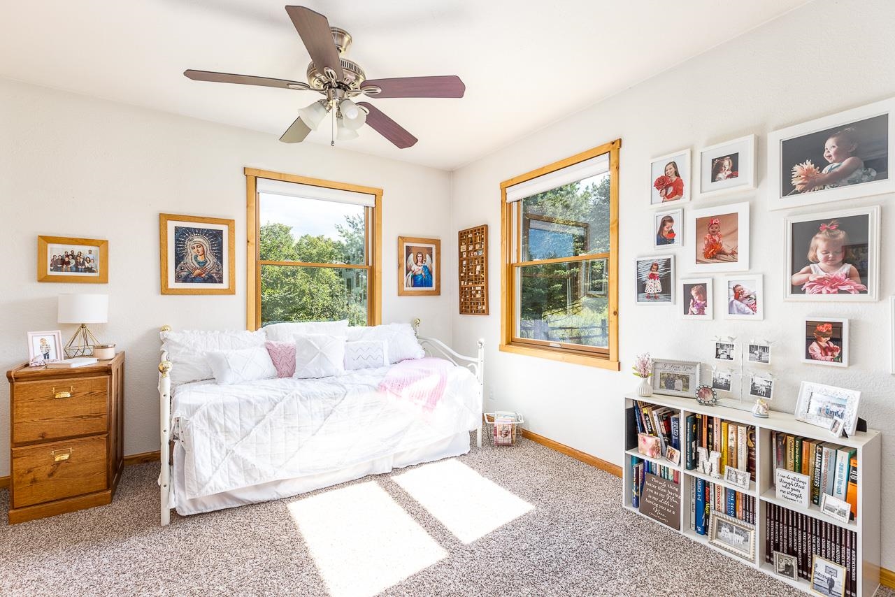6287 South Perryville Road Cherry Valley, IL 61016 - Photo 14 of 38 a bed room with a bed and a window