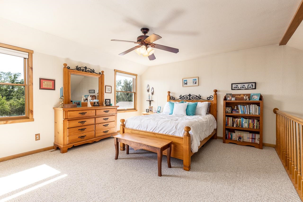 6287 South Perryville Road Cherry Valley, IL 61016 - Photo 18 of 38 a bed room with furniture and a window