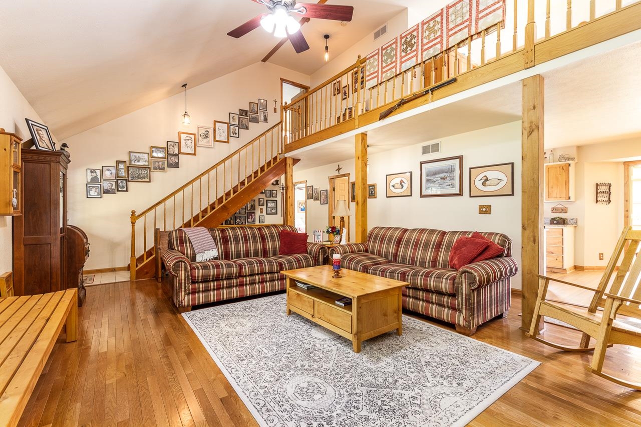 6287 South Perryville Road Cherry Valley, IL 61016 - Photo 6 of 38 a living room with lots of furniture and rug floor