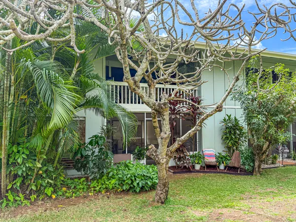 a view of front of house with a yard