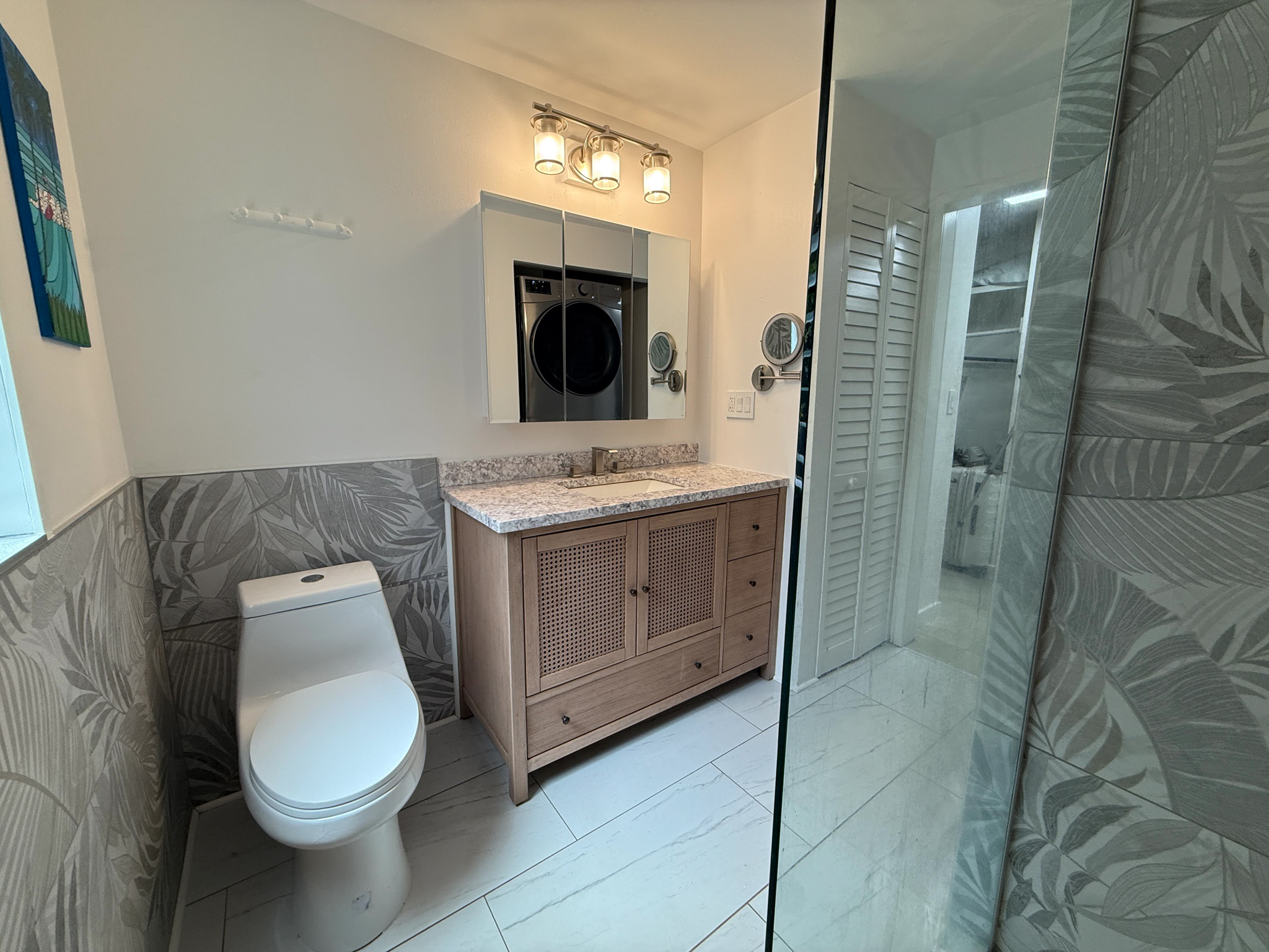 3057 Poipu Road, Unit D13 Koloa, HI 96756 - Photo 12 of 18 a bathroom with a toilet sink and mirror