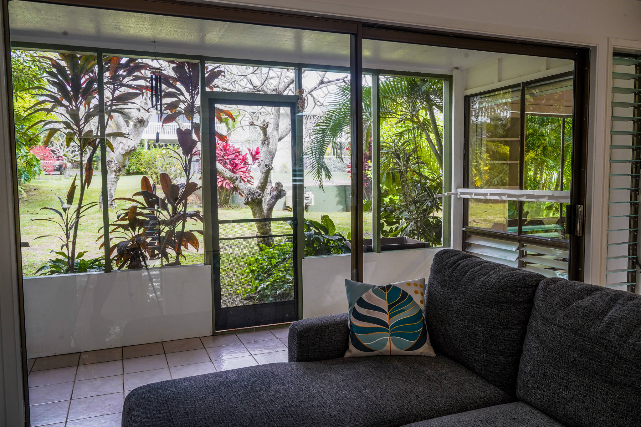 3057 Poipu Road, Unit D13 Koloa, HI 96756 - Photo 13 of 18 a living room with furniture and a window