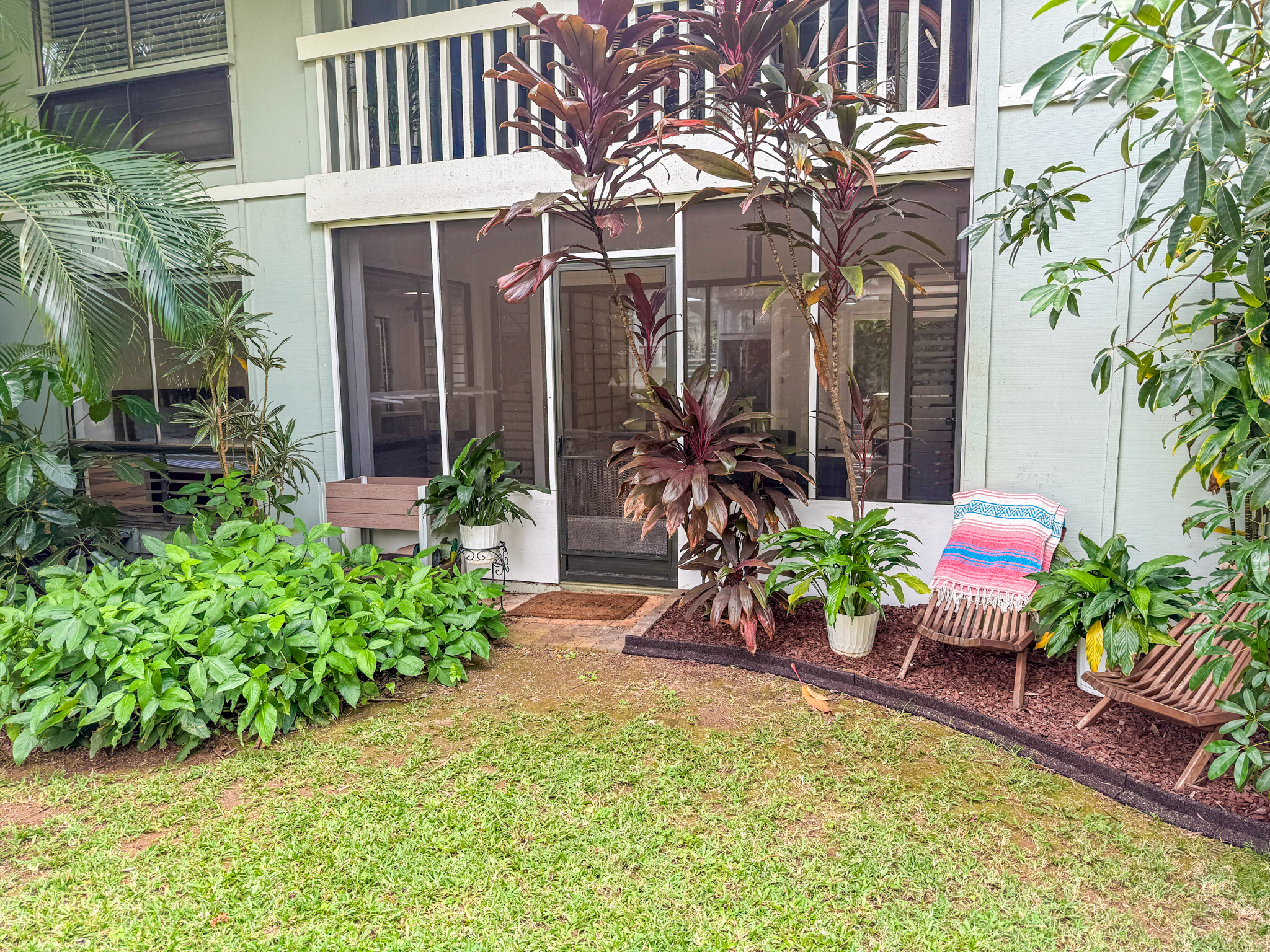 3057 Poipu Road, Unit D13 Koloa, HI 96756 - Photo 14 of 18 a view of a house with a backyard and sitting area