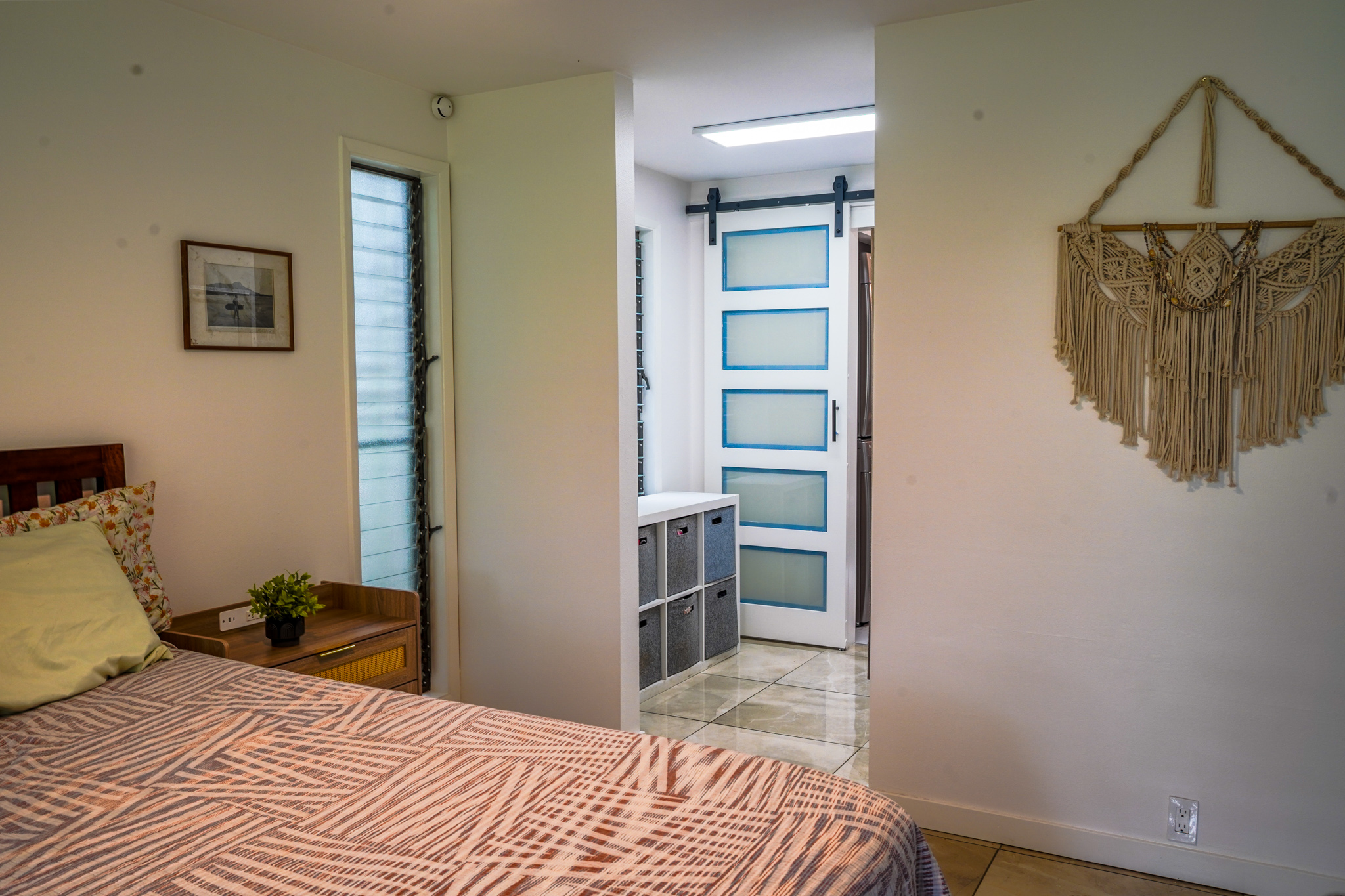 3057 Poipu Road, Unit D13 Koloa, HI 96756 - Photo 7 of 18 a bedroom with a bed and a view of bathroom