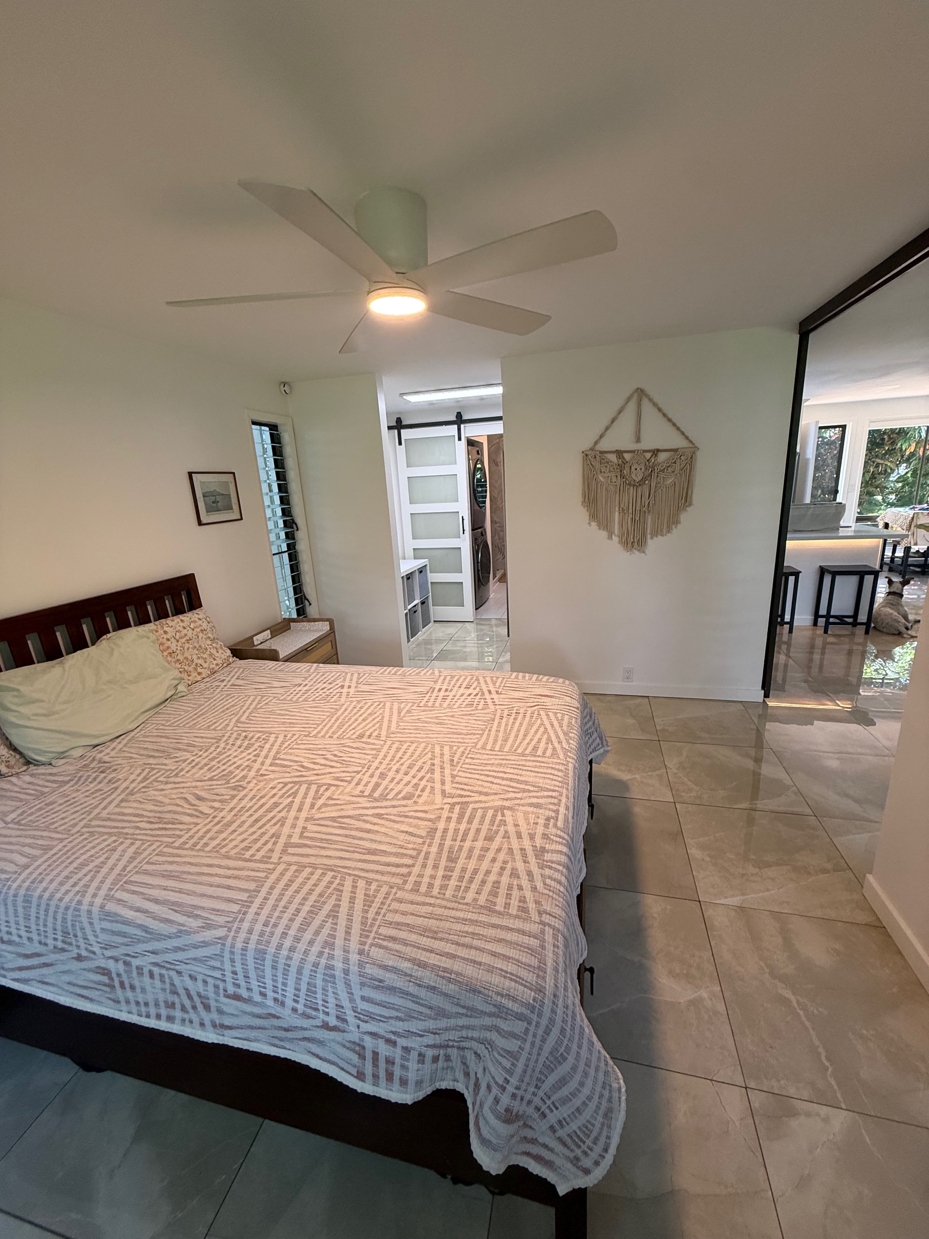 3057 Poipu Road, Unit D13 Koloa, HI 96756 - Photo 7 of 18 a bedroom with a bed and painting on the wall