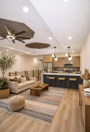 a living room with furniture and kitchen view