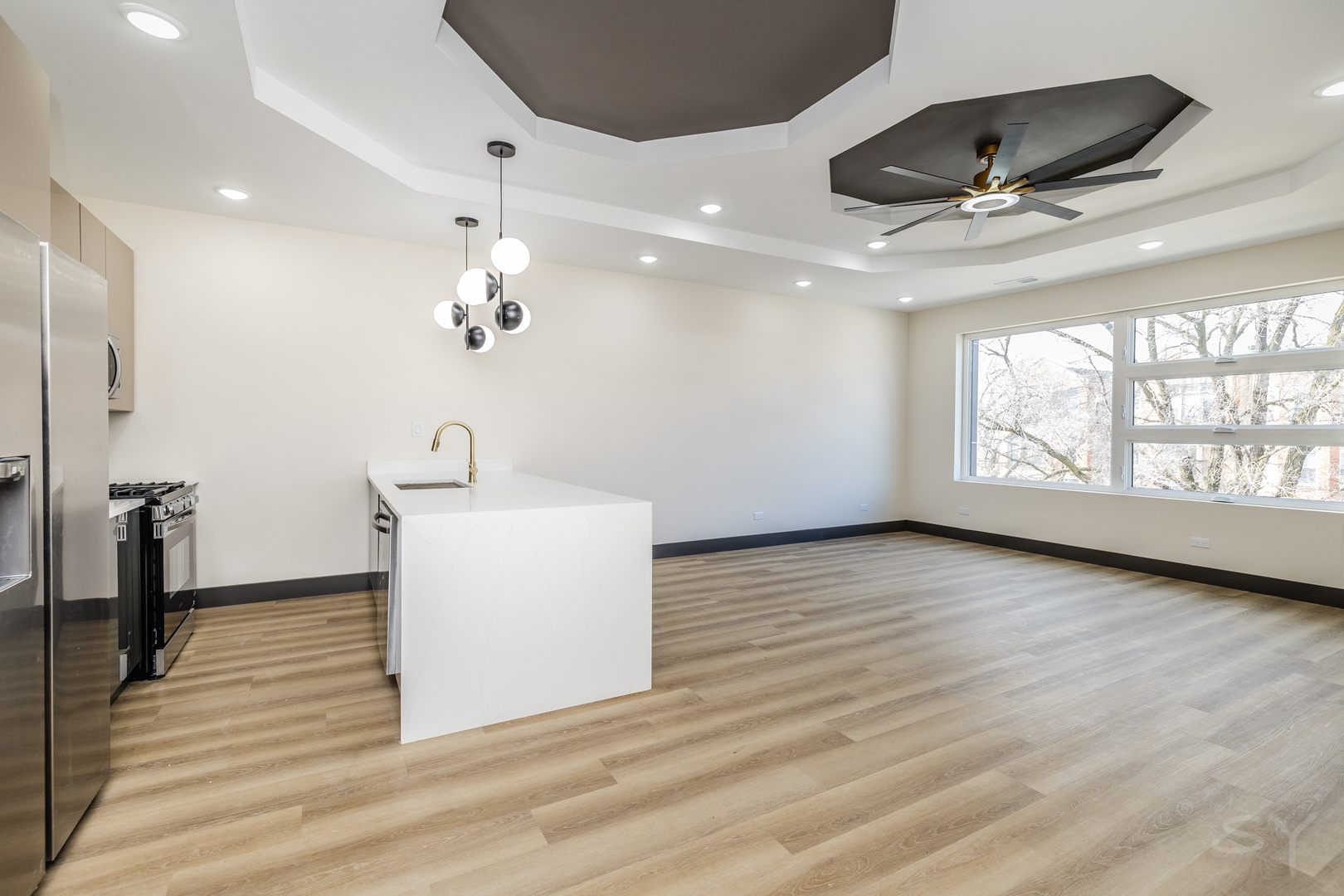 5643 South Prairie Avenue, Unit 1 Chicago, IL 60637 - Photo 5 of 15 a view of a livingroom with a ceiling fan and wooden floor